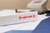 Brother laminated tape TZe-132 - Red on clear_thumb_3